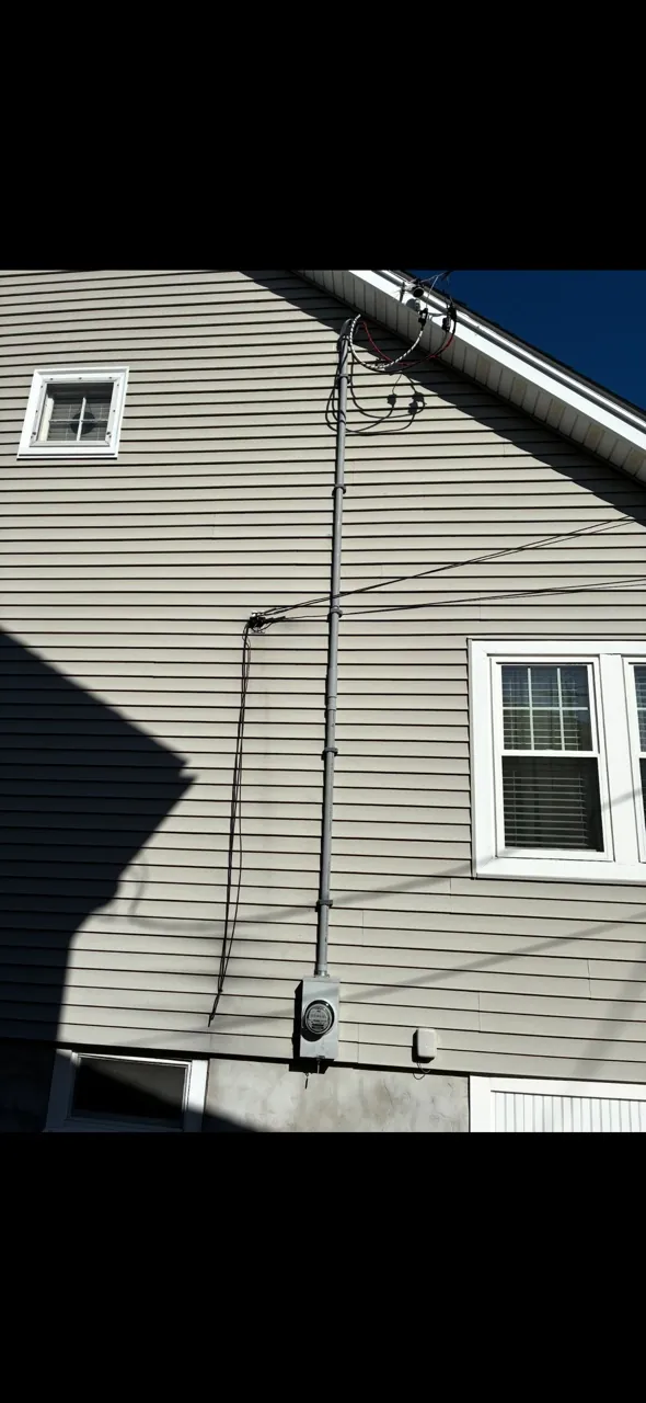 Overhead electrical service mast replacement in Quincy, MA