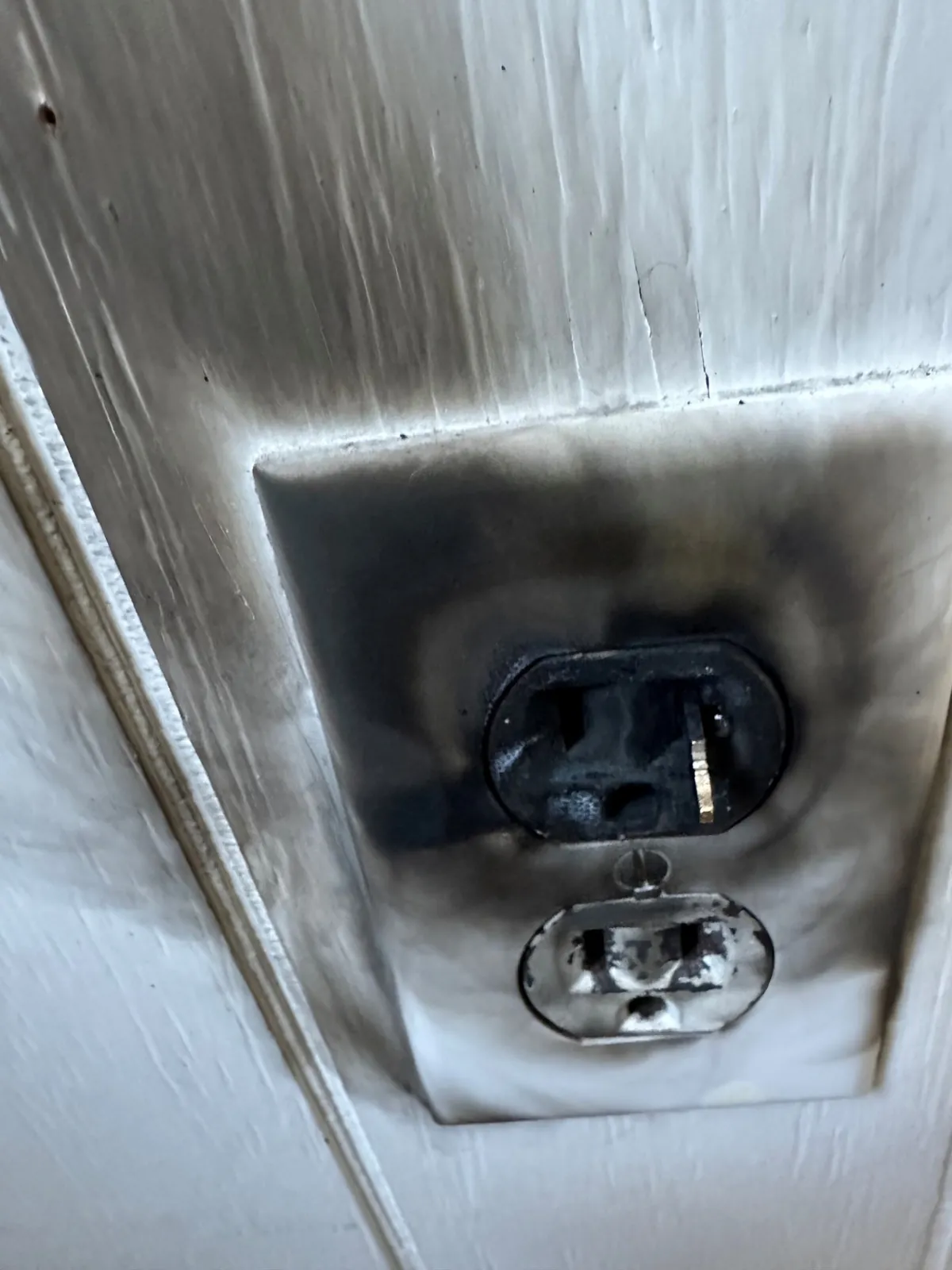 Scorched electrical outlet being replaced in South Boston, MA