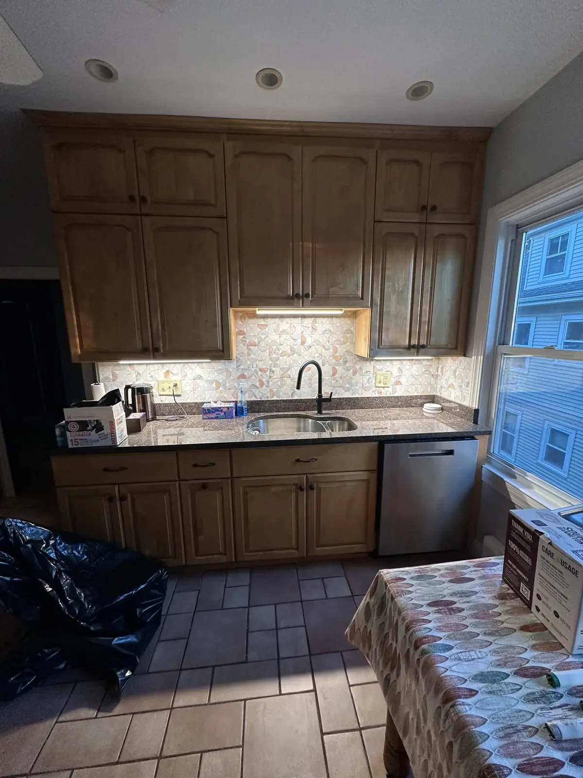 Under-cabinet lighting installed in a Quincy, MA kitchen